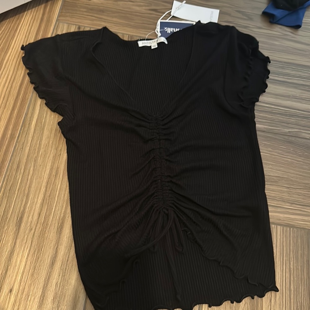 Black top with a low V neck.